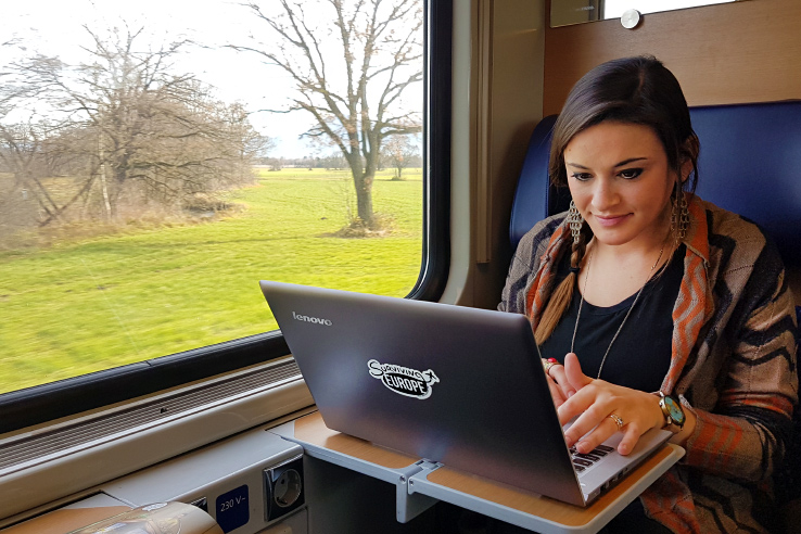 Surviving Europe: How to Follow Through on Your New Years Resolution to Travel - Working in a Train