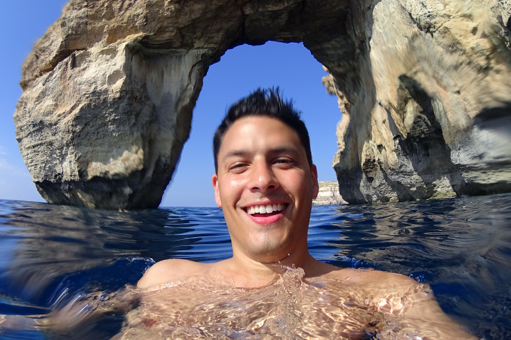 Surviving Europe: In Memory of the Azure Window in Gozo Malta - Erin Swimming Under Window